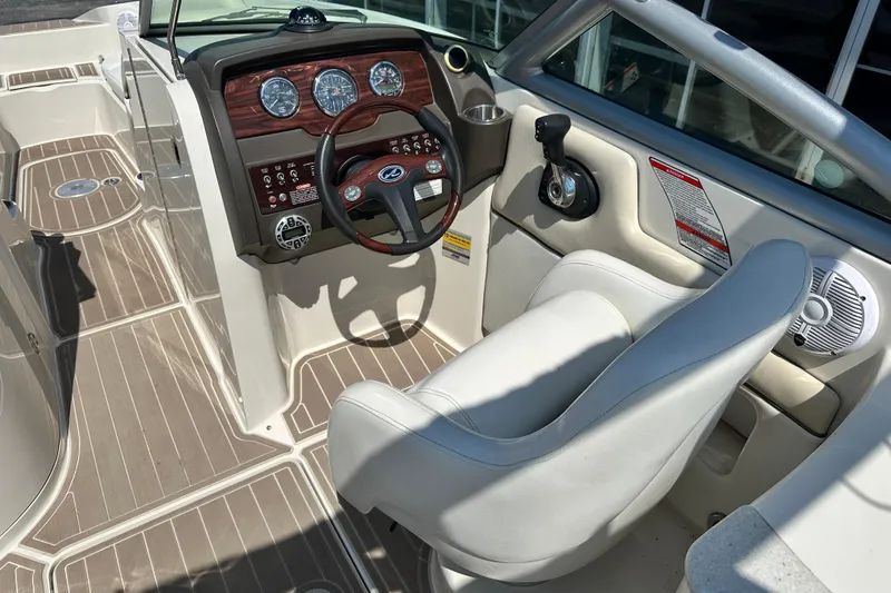 Slide: The Image of 2008 Sea Ray 260 Sundeck cockpit with steering wheel and control panel. - 5