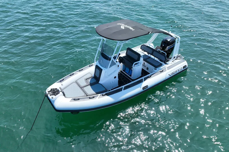 The Image of 2026 Highfield Sport 560 boat on clear blue water, featuring sleek design and modern amenities. - 0