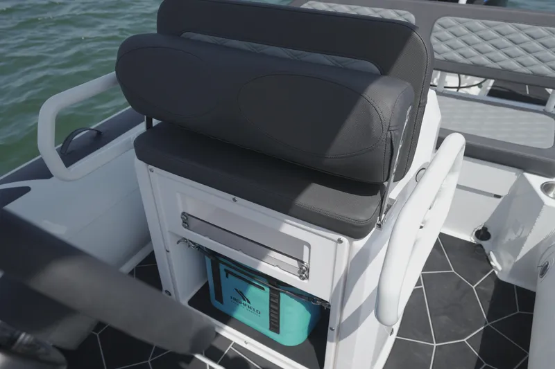 Slide: The Image of 2026 Highfield Sport 560 boat interior with cushioned seating and storage. - 13
