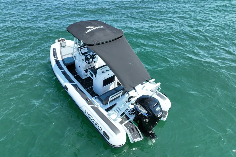 Slide: The Image of 2026 Highfield Sport 560 boat with canopy on open water. - 4