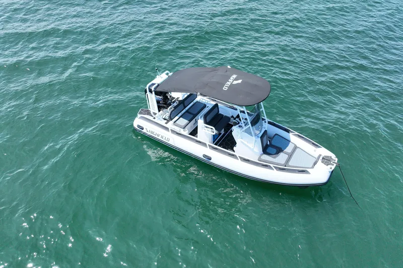 Slide: The Image of 2026 Highfield Sport 560 boat on clear blue water, aerial view. - 5
