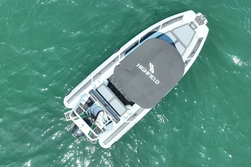 Slide: The Image of Aerial view of 2026 Highfield Sport 560 boat on clear green water. - 6