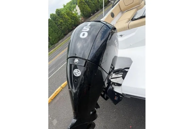 Slide: The Image of 2022 Glastron GX 210 Sport boat with a 150 HP outboard motor. - 7