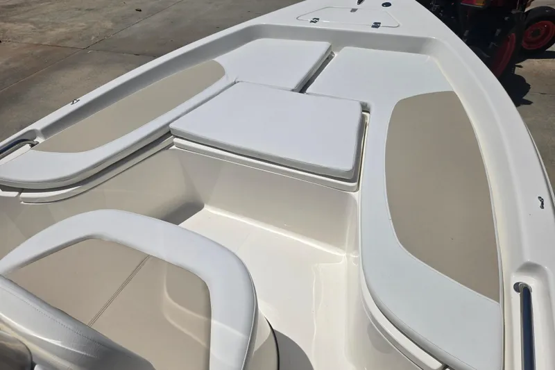 Slide: The Image of 2026 Bulls Bay 2000 boat interior with cushioned seating and storage compartments. - 10