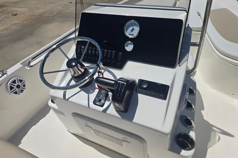 Slide: The Image of Steering console of a 2026 Bulls Bay 2000 boat with modern controls and gauges. - 11