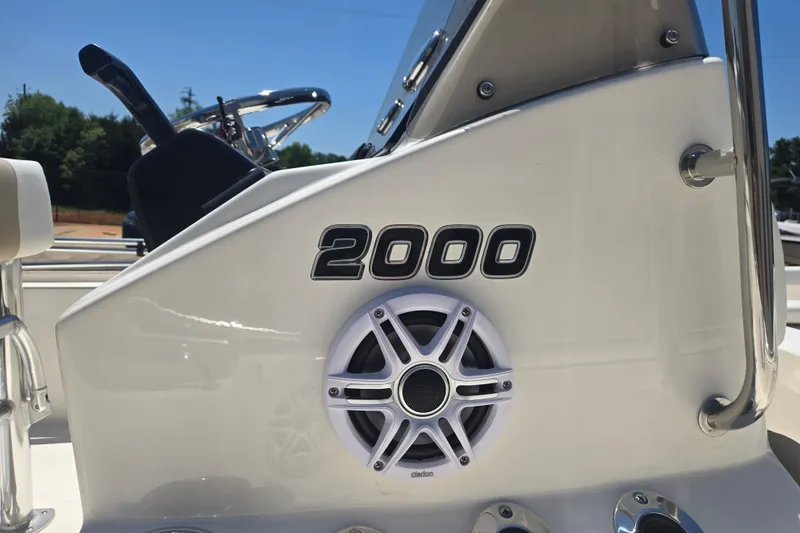Slide: The Image of Bulls Bay 2000 boat console with speaker, 2026 model, under clear blue sky. - 14