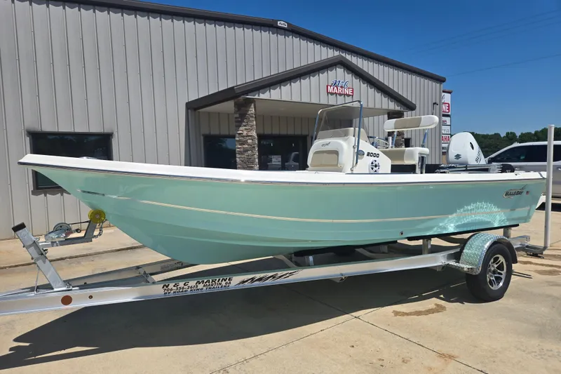 Slide: The Image of 2026 Bulls Bay 2000 boat on trailer outside marine dealership. - 3