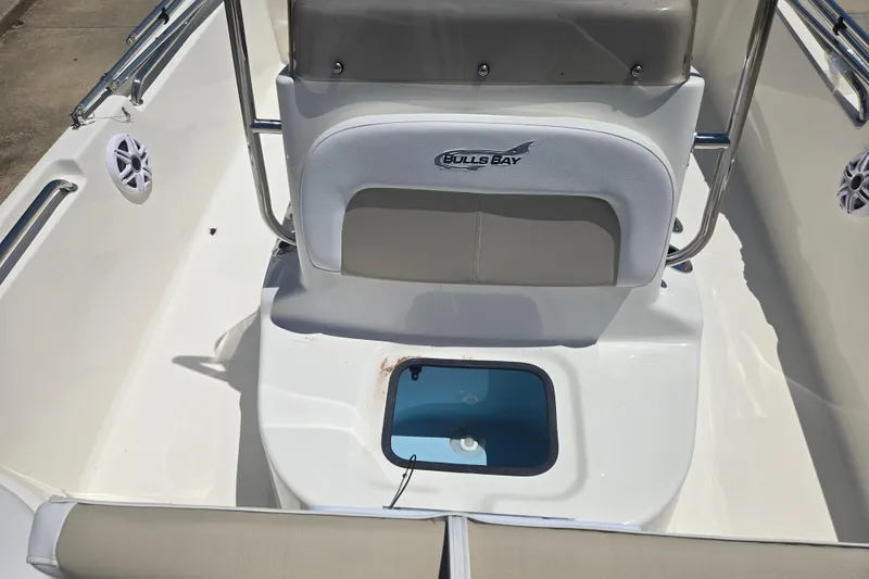 Slide: The Image of 2026 Bulls Bay 2000 boat interior with seating and storage compartment. - 5