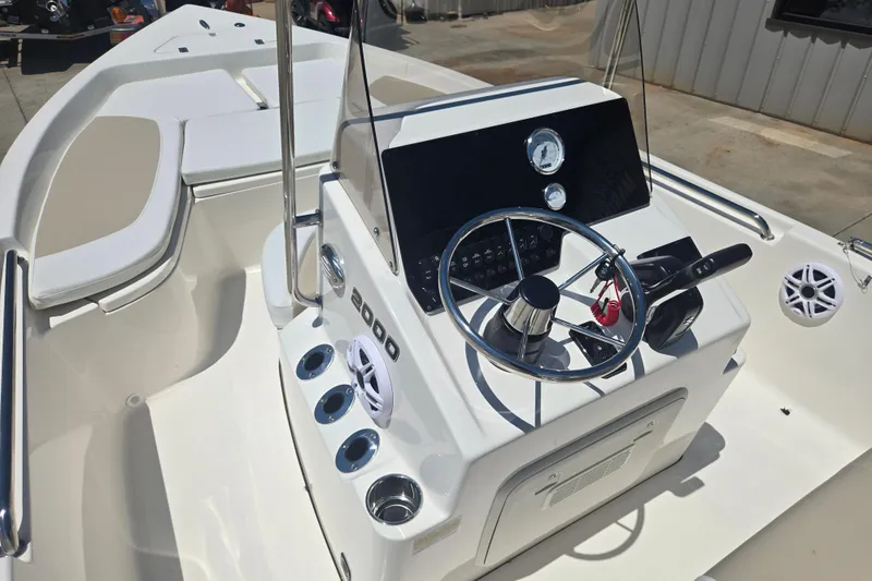 Slide: The Image of 2026 Bulls Bay 2000 boat interior with steering wheel and control panel. - 7