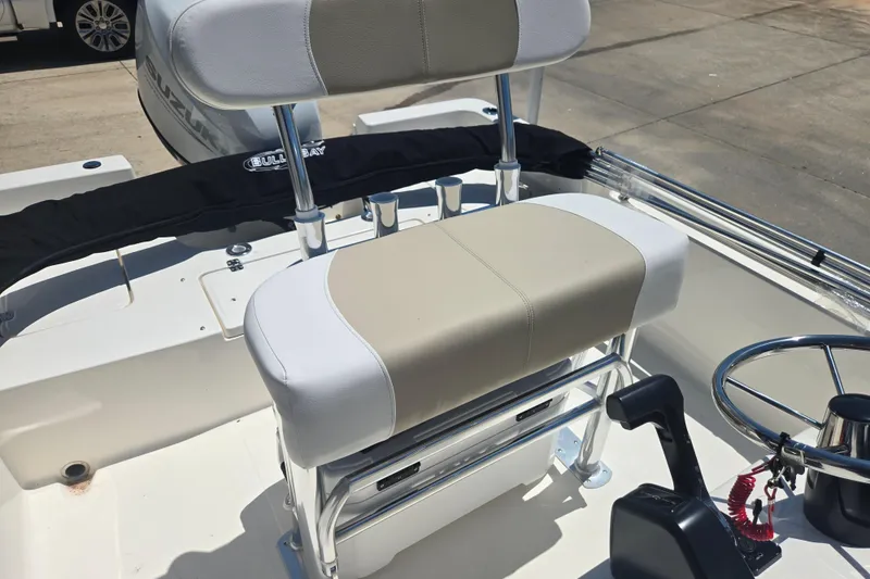 Slide: The Image of 2026 Bulls Bay 2000 boat interior with steering wheel and seating. - 9