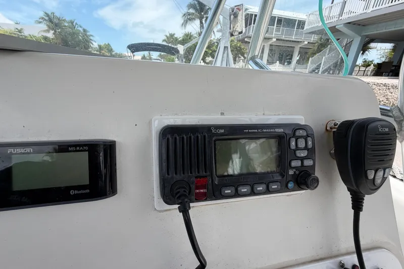 Slide: The Image of Control panel of a 2004 Triton 2895 CC boat with radio and Bluetooth display. - 28