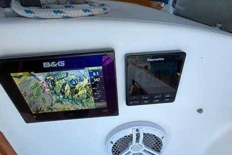 Slide: The Image of Navigation equipment on a 1985 Sabre 32 sailboat, featuring B&G and Raymarine displays. - 19