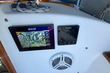Slide: The Image of 1985 Sabre 32 sailboat cockpit with B&G navigation display and Raymarine instrument panel. - 20