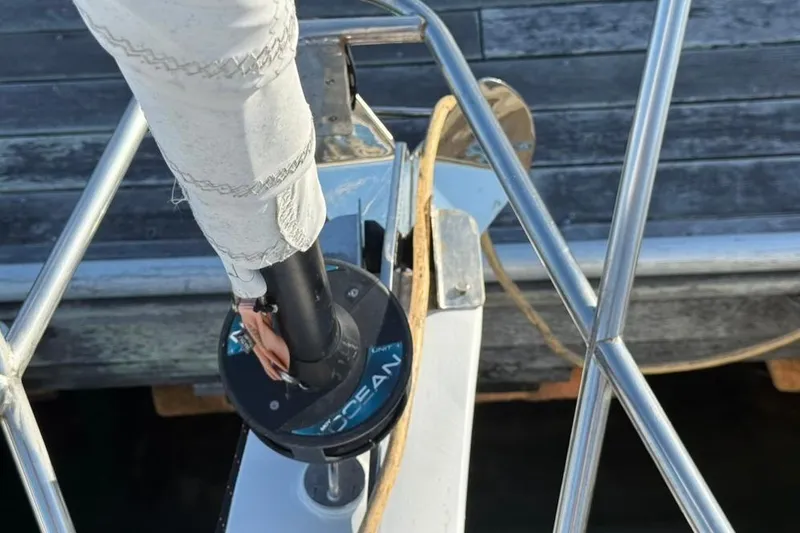 Slide: The Image of Bow of 1985 Sabre 32 sailboat with furling system and railing. - 28