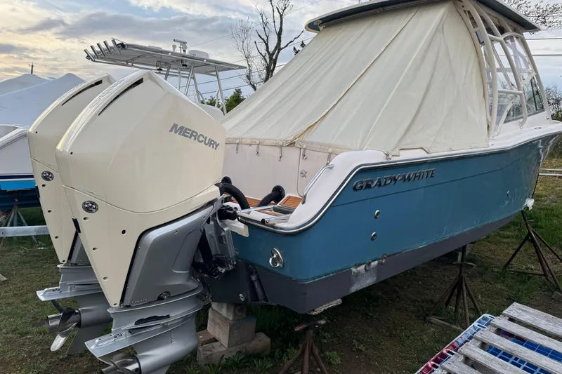 Slide: The Image of 2010 Grady-White Tournament 275 boat with dual Mercury outboard engines on display. - 3
