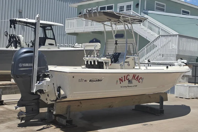 Slide: The Image of 2021 Bulls Bay 2200 boat with Yamaha engine in a marina setting. - 7