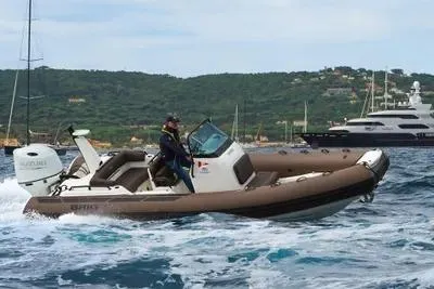 Slide: The Image of 2026 Brig Eagle 6.7 boat cruising on open water with scenic coastal backdrop. - 11