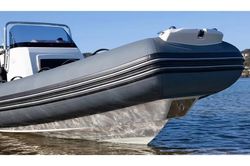 Slide: The Image of Manufacturer Provided Image: 2026 Brig Eagle 6.7 boat on water, showcasing sleek design and modern features. - 6