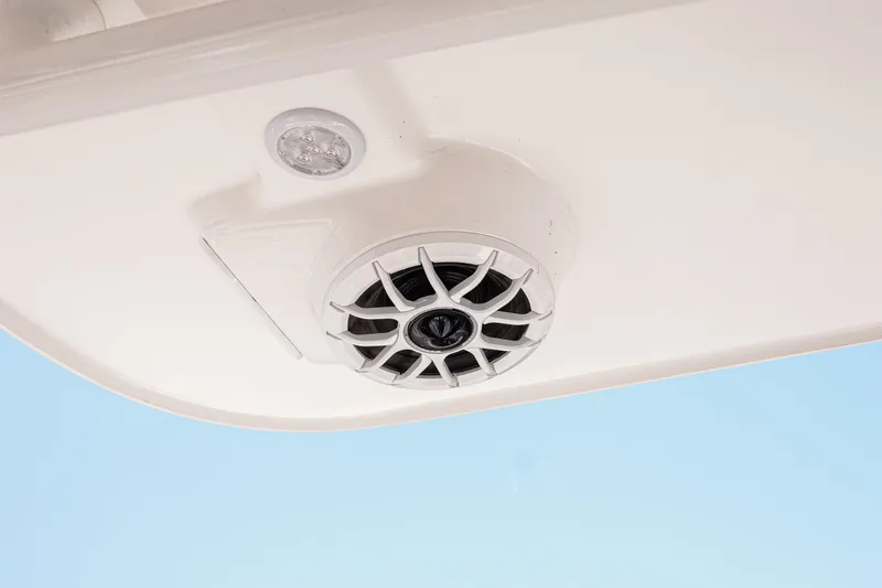 Slide: The Image of Speaker and light fixture on 2024 NauticStar 292 Legacy boat ceiling. - 22