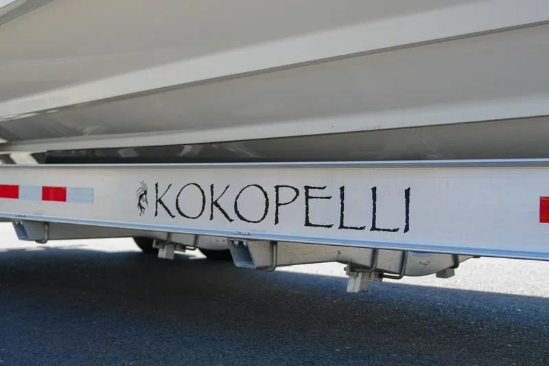 Slide: The Image of Trailer with "KOKOPELLI" text for 2024 NauticStar 292 Legacy boat. - 33
