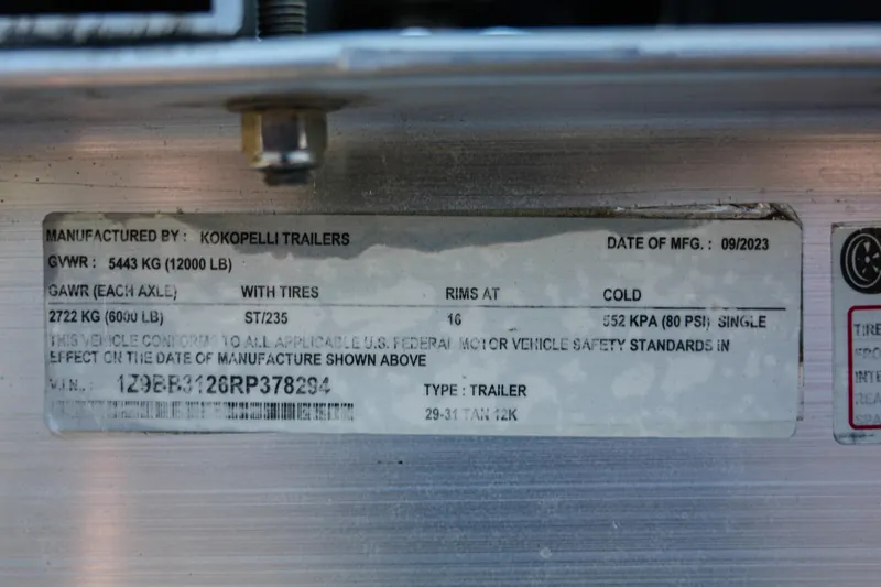 Slide: The Image of Label on Kokopelli trailer, manufactured 09/2023, showing specifications and compliance details. - 38