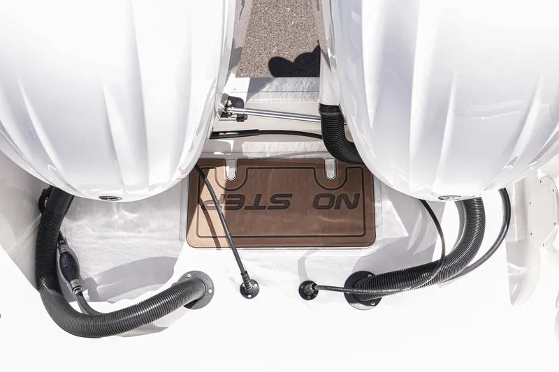 Slide: The Image of Trailer wheel of 2024 NauticStar 292 Legacy boat, featuring black alloy rim and tire. - 44