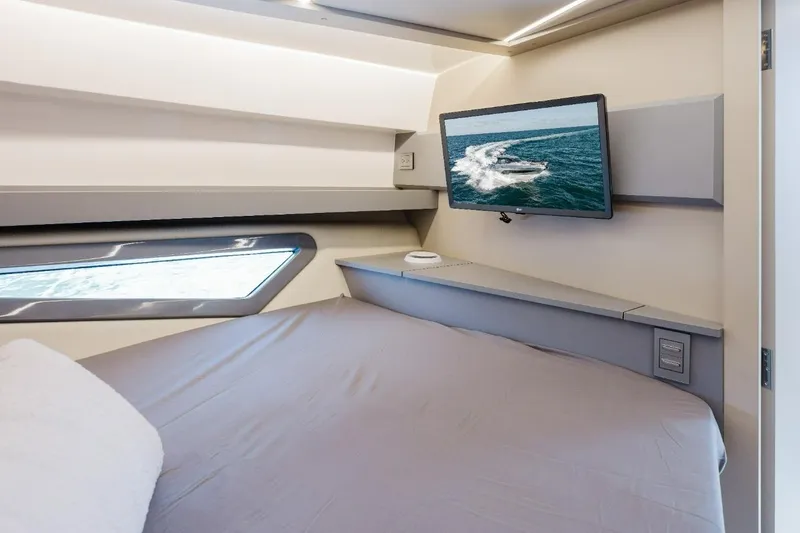 Slide: The Image of Luxurious cabin interior of 2027 Hanover 415 yacht with modern TV and sleek design. - 11