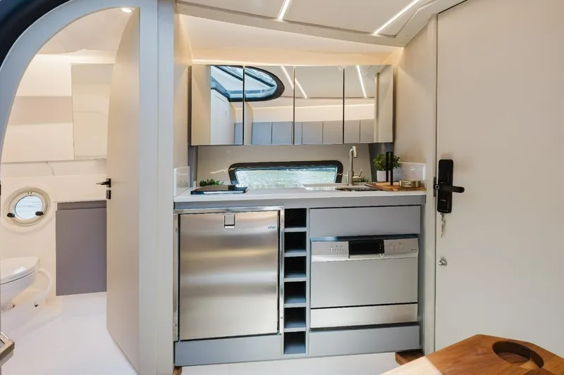 Slide: The Image of Modern kitchen interior in 2027 Hanover 415, featuring sleek appliances and minimalist design. - 3