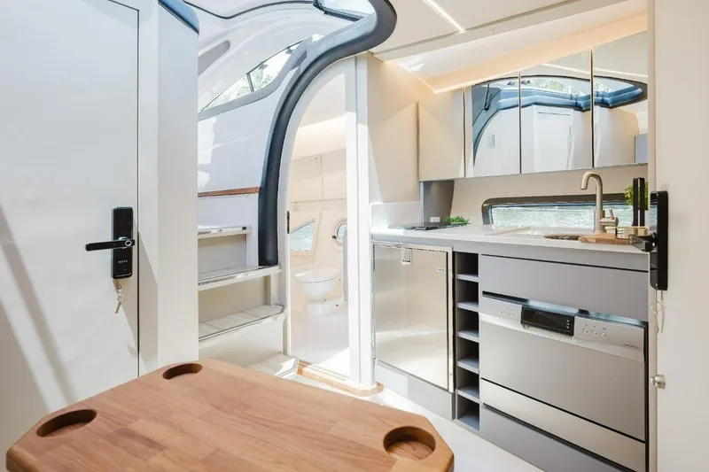Slide: The Image of Modern interior of 2027 Hanover 415 yacht with sleek kitchen and natural light. - 4