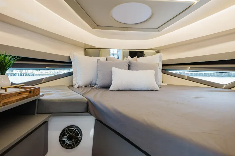 Slide: The Image of Luxurious interior cabin of a 2027 Hanover 415 yacht with modern bedding and decor. - 7