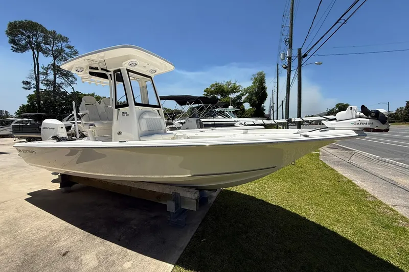 The Image of 2026 Key West 230 Bay Reef boat displayed outdoors on a sunny day. - 0