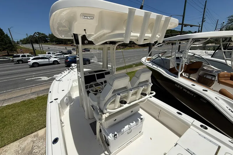 Slide: The Image of 2026 Key West 230 Bay Reef boat with dual seats and steering console. - 13