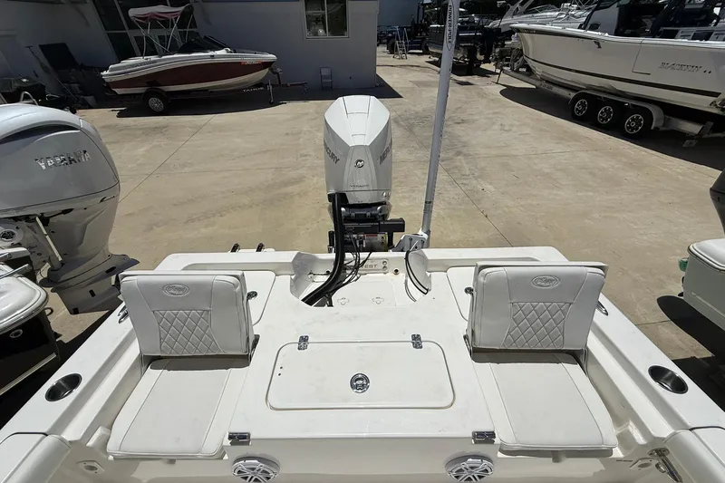 Slide: The Image of 2026 Key West 230 Bay Reef boat with dual seats and Mercury outboard motor. - 15