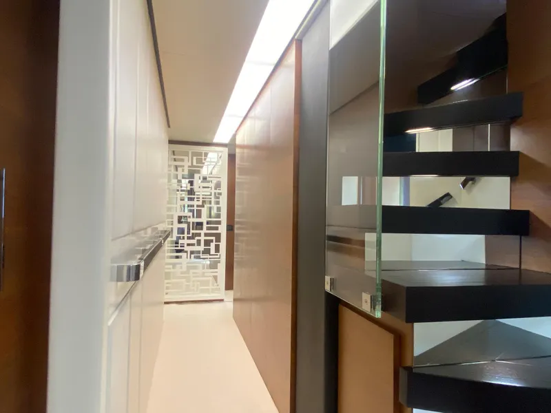 Slide: The Image of Modern interior of 2014 Azimut 100 Grande yacht with sleek staircase and stylish decor. - 25
