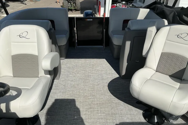 Slide: The Image of Interior of 2025 Qwest E-Class RLS 16 pontoon boat with plush seating. - 11