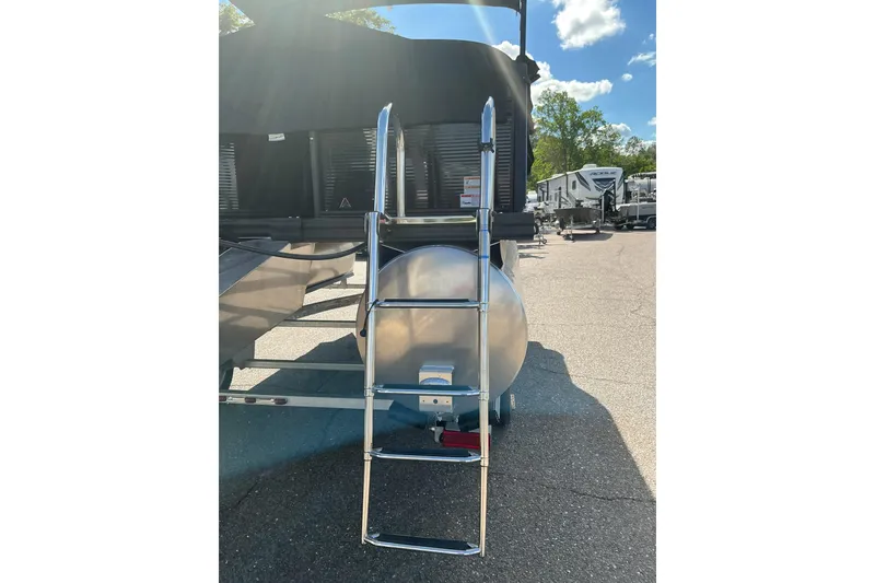 Slide: The Image of Rear view of 2025 Qwest E-Class RLS 16 pontoon boat with ladder. - 14