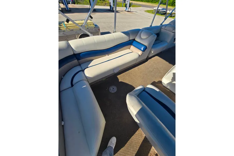 Slide: The Image of Interior view of a 2005 Lowe Jamaica 250SD boat with cushioned seating. - 7