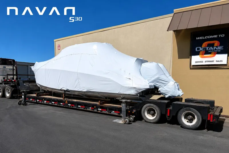 Slide: The Image of Covered Navan S30 boat on trailer outside Octane Marine, 2026 model. - 10