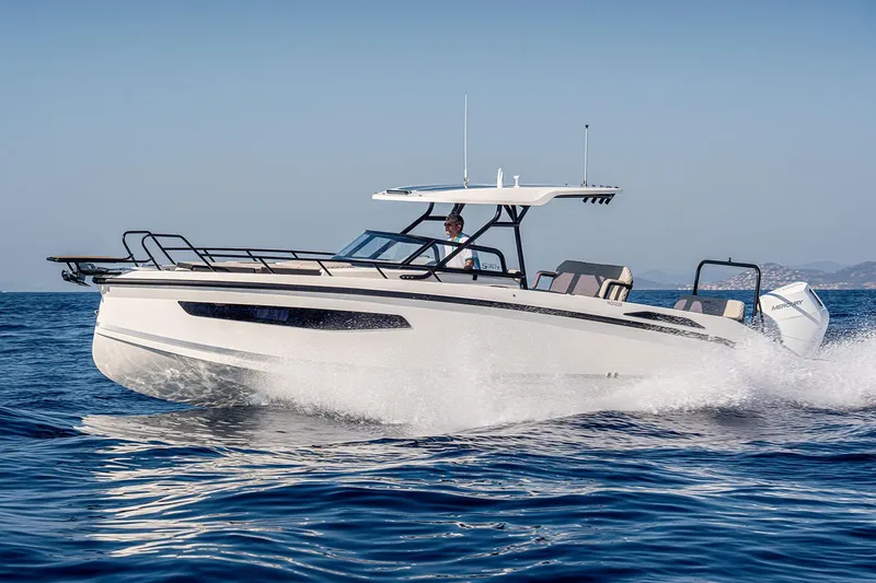 Slide: The Image of Manufacturer Provided Image: 2026 Navan S30 boat cruising on open water, showcasing sleek design and performance. - 11