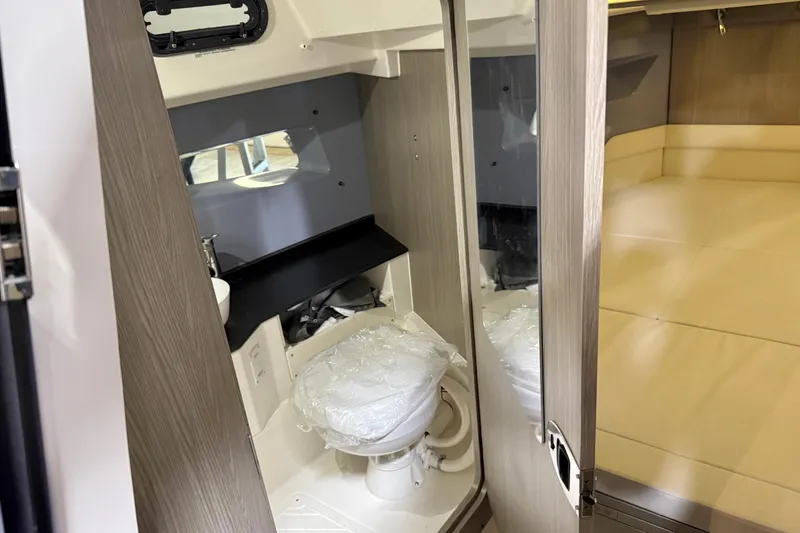 Slide: The Image of Modern bathroom interior of 2026 Navan S30 boat with compact design and wooden accents. - 7