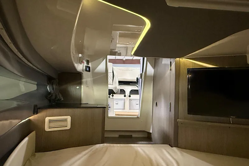 Slide: The Image of Interior of 2026 Navan S30 RV, featuring modern design, ambient lighting, and a mounted TV. - 8