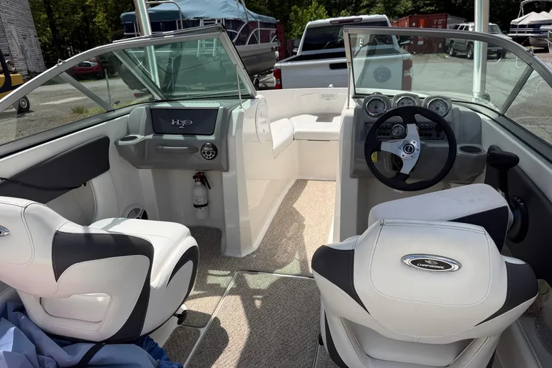 Slide: The Image of Interior of 2012 Chaparral 18 H2O Sport boat with steering wheel and seating. - 11