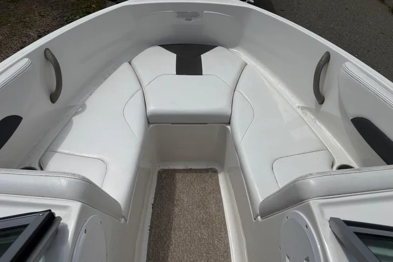 Slide: The Image of Interior view of a 2012 Chaparral 18 H2O Sport boat with white seating. - 13