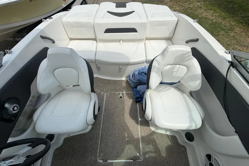 Slide: The Image of Interior of a 2012 Chaparral 18 H2O Sport boat with white seating. - 15