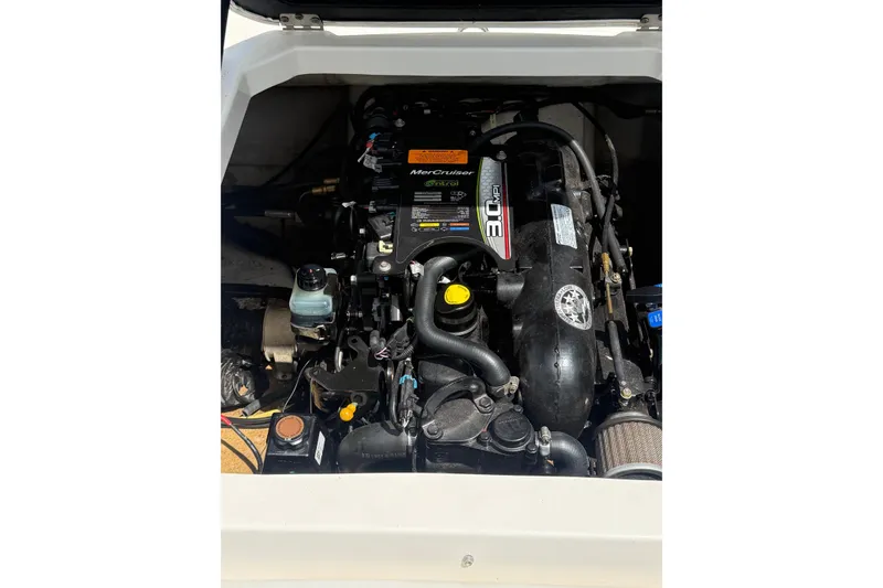 Slide: The Image of Engine compartment of a 2012 Chaparral 18 H2O Sport boat, featuring a MerCruiser 3.0 MPI engine. - 17