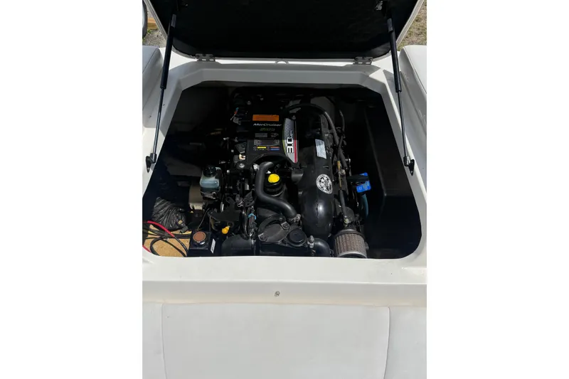 Slide: The Image of Engine compartment of 2012 Chaparral 18 H2O Sport boat, featuring MerCruiser engine. - 18