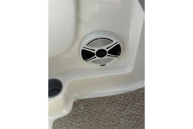 Slide: The Image of Speaker and cup holder on 2012 Chaparral 18 H2O Sport boat interior. - 21