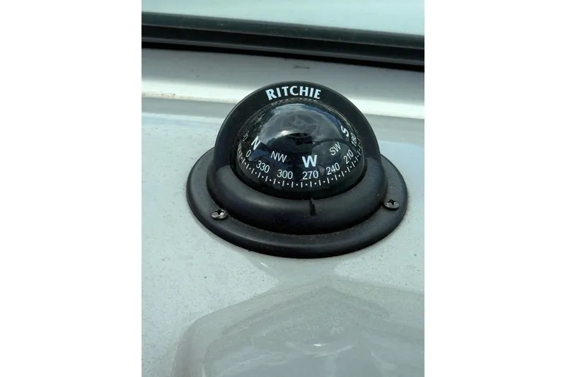 Slide: The Image of Compass on 2012 Chaparral 18 H2O Sport boat dashboard. - 23