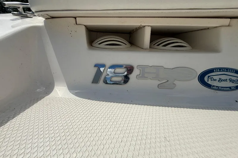 Slide: The Image of 2012 Chaparral 18 H2O Sport boat interior with logo and speaker details. - 6