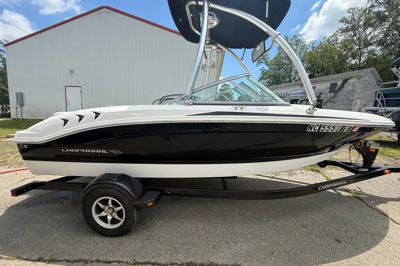 Slide: The Image of 2012 Chaparral 18 H2O Sport boat on trailer, parked outdoors. - 8